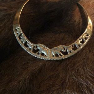 Brass elephant collar.